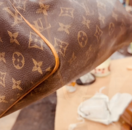 sac Louis Vuitton réparé. Angle refermé quasi invisible
